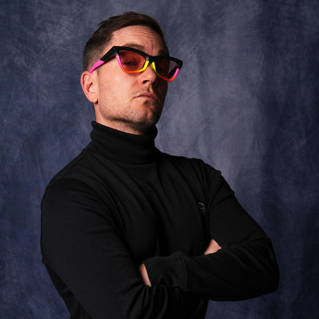 very important businessman wearing a turtleneck and cat-eye sunglasses